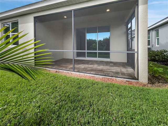 rear view of property with a patio area and a yard