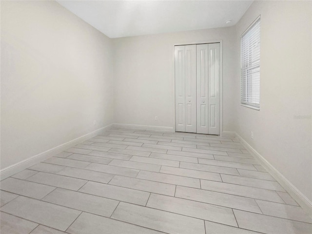 unfurnished bedroom with a closet