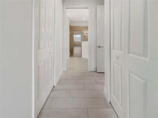 hallway with light tile patterned floors