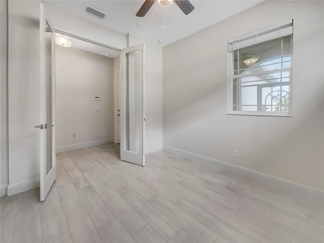 unfurnished bedroom featuring ceiling fan and light hardwood / wood-style floors