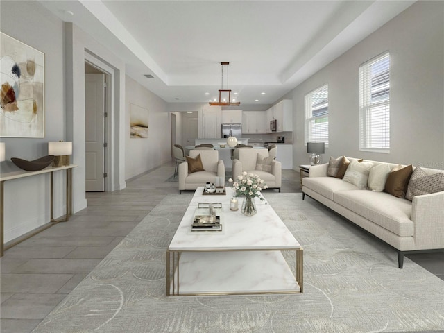 living room with light hardwood / wood-style floors and a notable chandelier