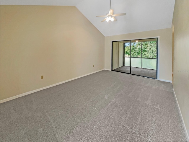 carpeted empty room with ceiling fan and high vaulted ceiling