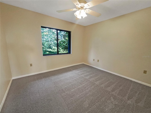 unfurnished room featuring ceiling fan and carpet flooring