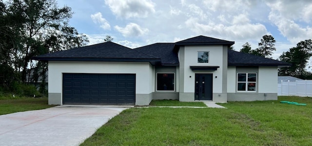 2572 SW 159th Ln, Ocala, FL 34473 - view of front of home featuring stucco siding, driveway, a shingled roof, and a garage