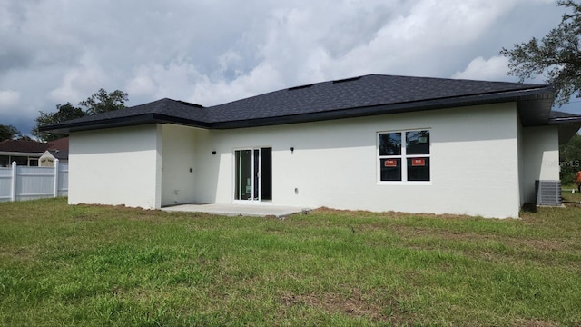 2572 SW 159th Ln, Ocala, FL 34473 - rear view of property featuring stucco siding, roof with shingles, central AC, and a patio area