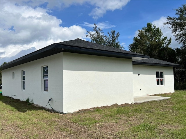 view of home's exterior featuring a yard