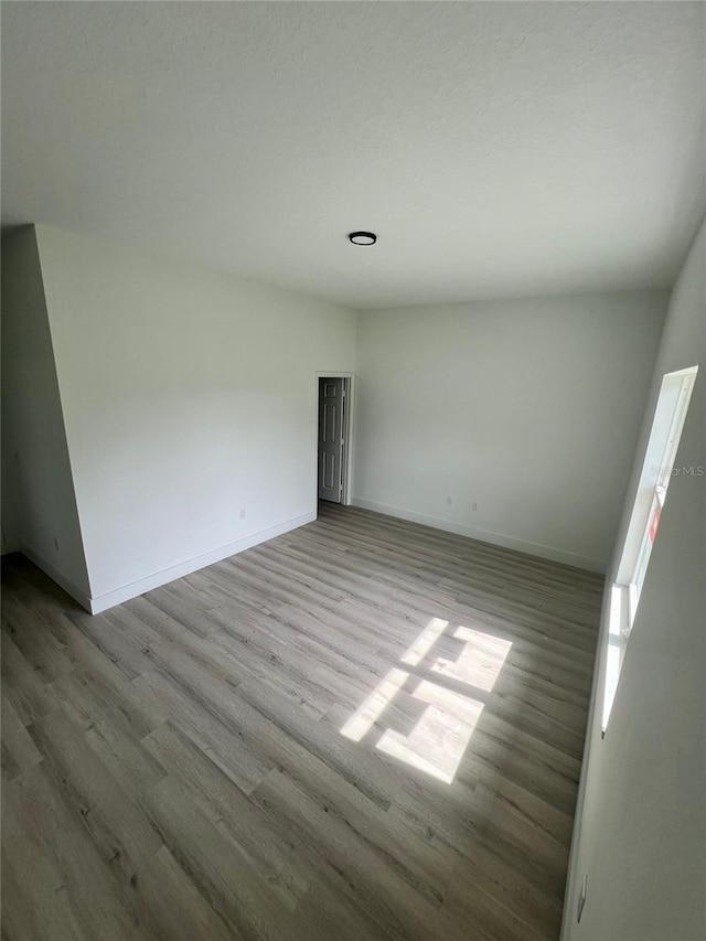 2572 SW 159th Ln, Ocala, FL 34473 - empty room featuring wood finished floors and baseboards