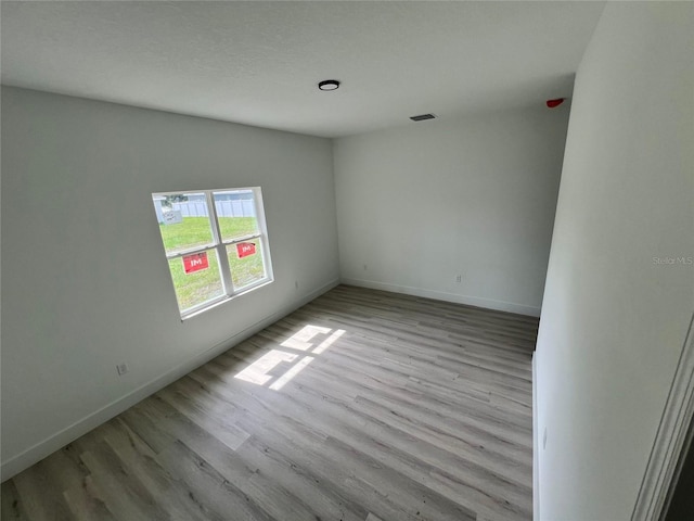 2572 SW 159th Ln, Ocala, FL 34473 - spare room featuring wood finished floors and baseboards