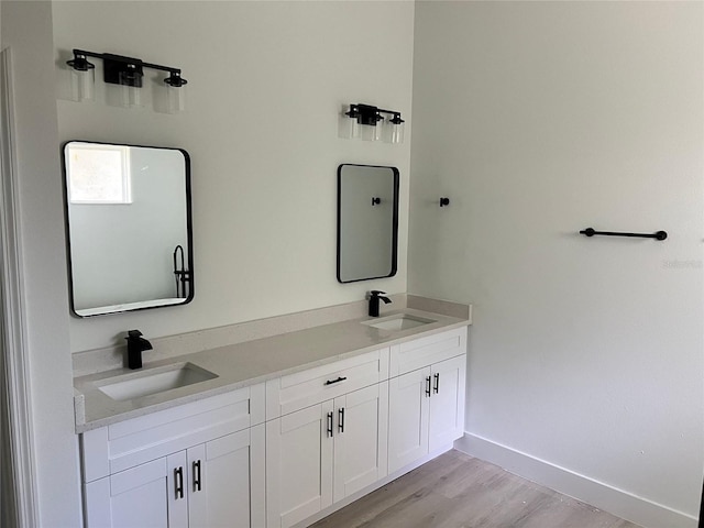 bathroom featuring vanity and hardwood / wood-style flooring