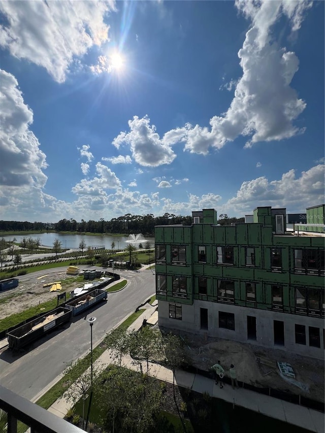 birds eye view of property with a water view