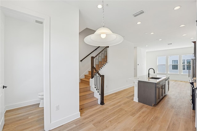 2110 Whitney Marsh Aly, Orlando, FL 32804 - kitchen with a sink, light wood-type flooring, baseboards, and recessed lighting