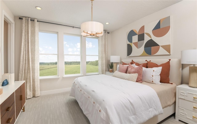 2110 Whitney Marsh Aly, Orlando, FL 32804 - bedroom featuring a chandelier, baseboards, recessed lighting, and light carpet