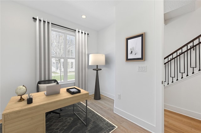 2110 Whitney Marsh Aly, Orlando, FL 32804 - office area featuring baseboards, plenty of natural light, and light wood-style floors