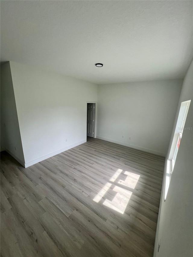 unfurnished room featuring light wood-type flooring