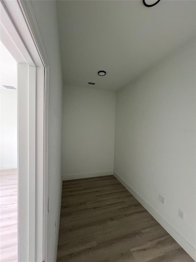 spare room with hardwood / wood-style floors