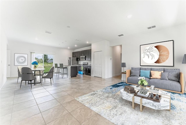 living room featuring light tile patterned flooring