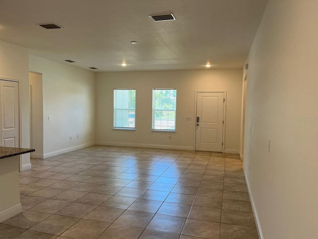 view of tiled spare room