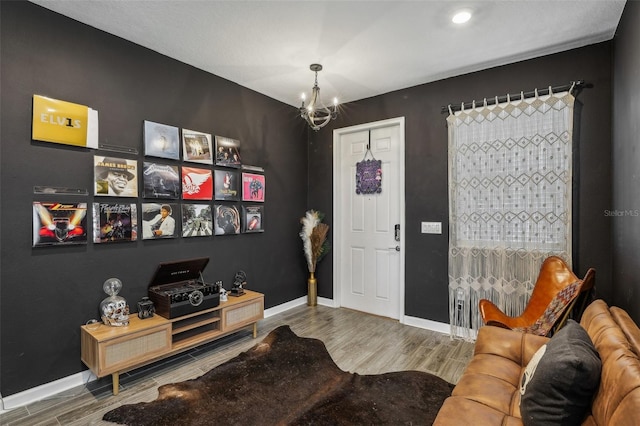 living room featuring hardwood / wood-style floors and a chandelier