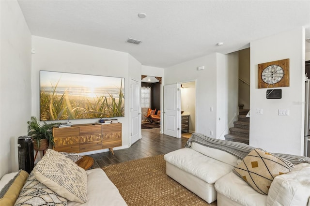 living room with dark hardwood / wood-style floors