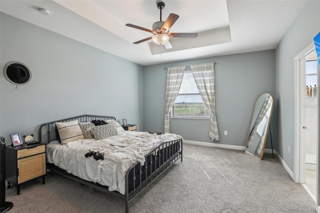 bedroom featuring carpet flooring, multiple windows, and ceiling fan