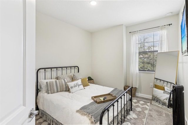 bedroom featuring light colored carpet