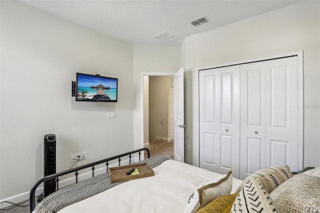 bedroom with a closet and carpet flooring