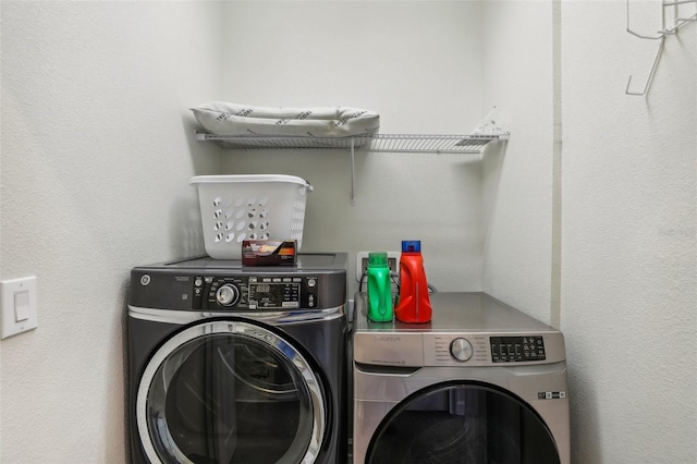 laundry area featuring washing machine and clothes dryer