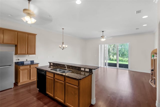 kitchen with dark hardwood / wood-style floors, black dishwasher, sink, and white refrigerator