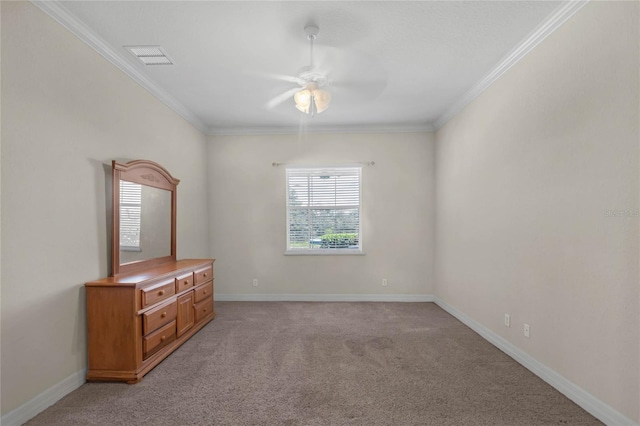 empty room with light carpet, ceiling fan, and ornamental molding