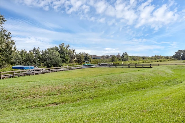 view of yard with a rural view