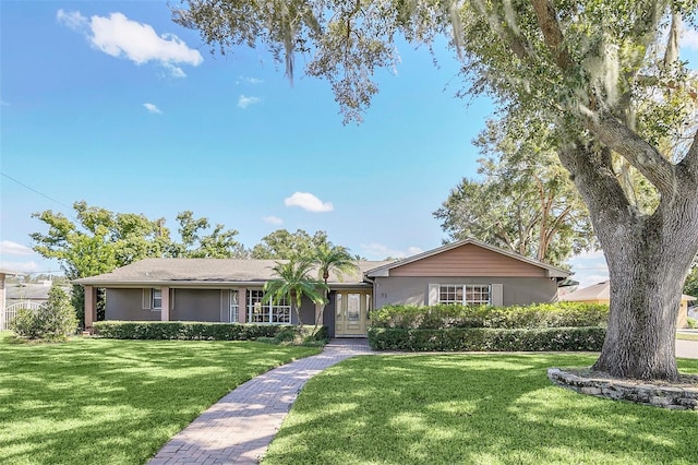 ranch-style home with a front yard