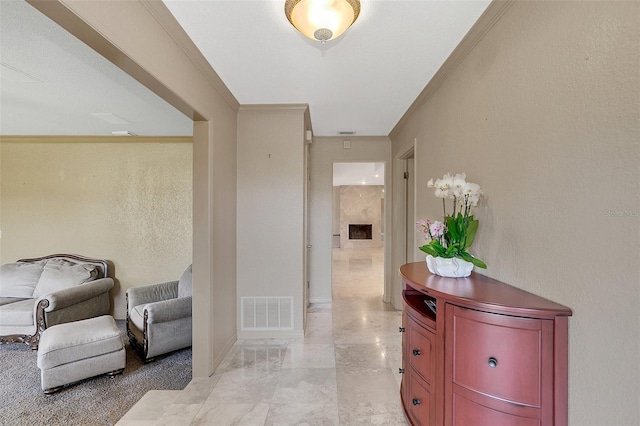 hallway featuring ornamental molding