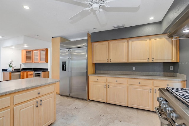 kitchen with sink, ceiling fan, stainless steel appliances, wine cooler, and light brown cabinets