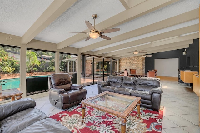 tiled living room featuring vaulted ceiling with beams, a textured ceiling, and ceiling fan