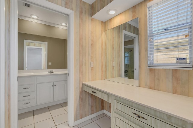 bathroom with vanity, wood walls, walk in shower, and tile patterned flooring