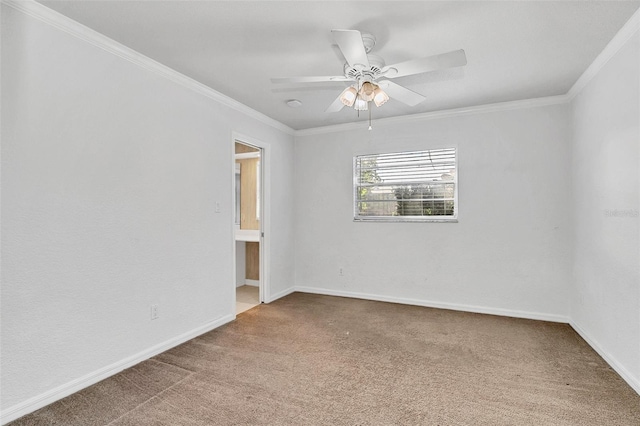 carpeted spare room with crown molding and ceiling fan