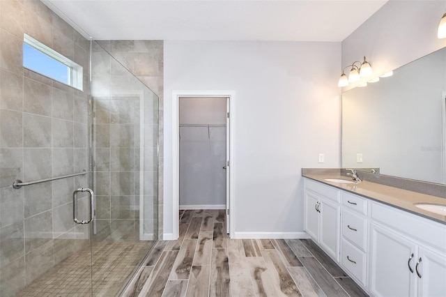 bathroom with vanity and an enclosed shower