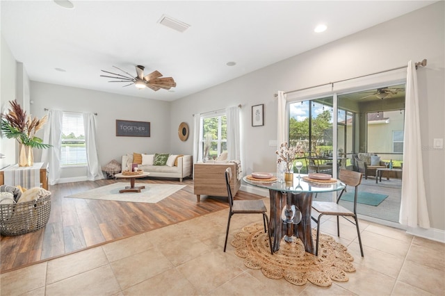 dining area featuring light hardwood / wood-style floors and ceiling fan