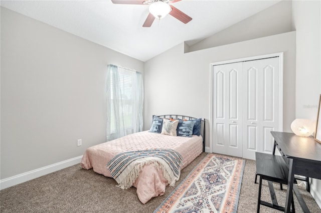 bedroom with carpet floors, lofted ceiling, ceiling fan, and a closet