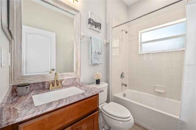 full bathroom featuring vanity, shower / tub combo, and toilet