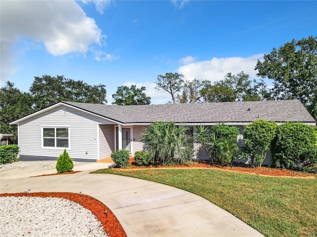 2281 E Union Cir, Deltona, FL 32725 - view of front of property featuring roof with shingles, concrete driveway, and a front yard