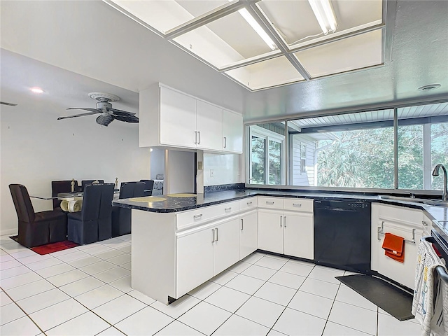 kitchen with kitchen peninsula, dishwasher, white cabinets, and plenty of natural light