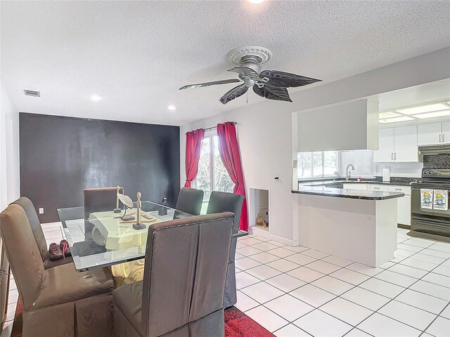 2281 E Union Cir, Deltona, FL 32725 - dining room featuring light tile patterned floors, a textured ceiling, visible vents, recessed lighting, and a ceiling fan