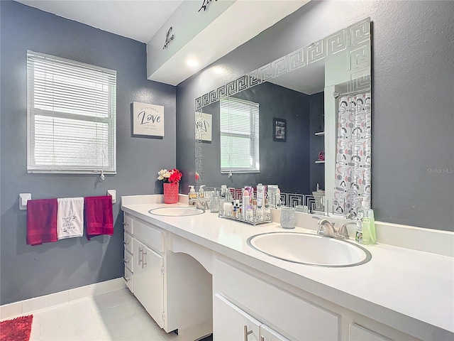 bathroom with vanity, toilet, and tile patterned flooring