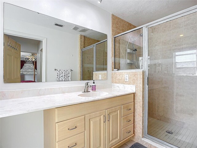 2281 E Union Cir, Deltona, FL 32725 - full bath featuring a walk in closet, visible vents, a shower stall, and vanity