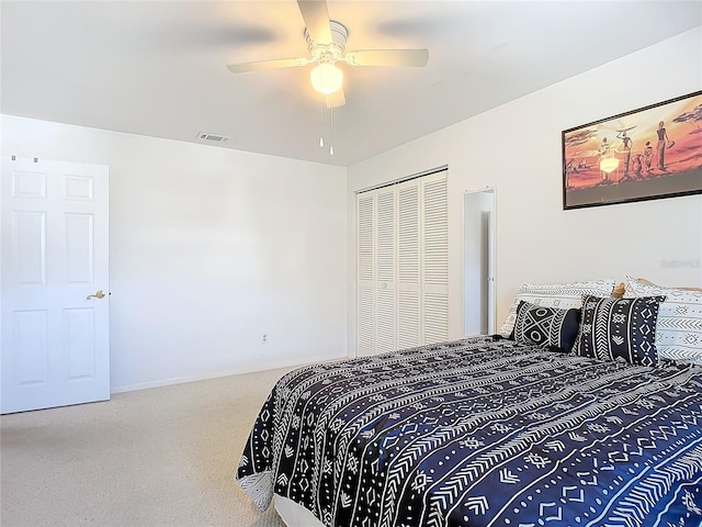 bedroom featuring carpet flooring, a closet, and ceiling fan