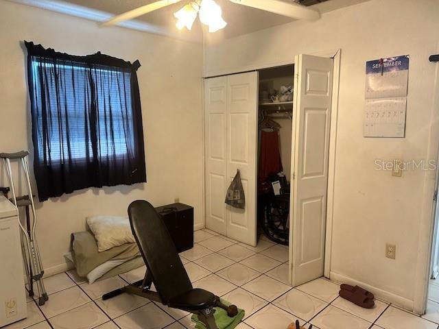 office space with ceiling fan and light tile patterned floors