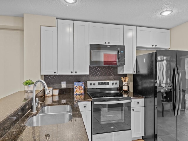 kitchen with black appliances, white cabinets, sink, and a textured ceiling