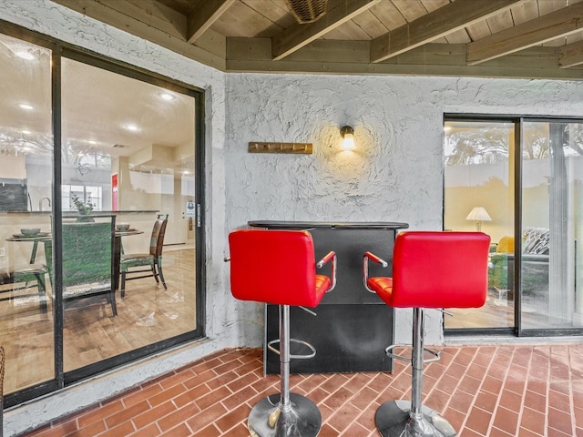 bar with beam ceiling and wood ceiling