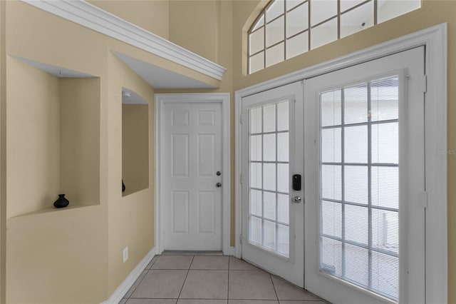 interior space featuring french doors and light tile patterned floors